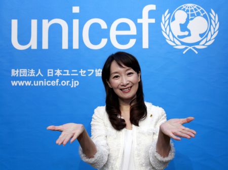 The UN Children's Fund (UNICEF) Goodwill Ambassador and singer Agnes Chan from Hong Kong gestures at an activity to mark the Universal Children's Day and the 20th anniversary of the adoption of the UN Convention on the Rights of the Child (CRC) in Tokyo, capital of Japan, November 20, 2009, the day of Universal Children's Day.