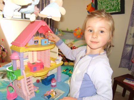 This photo I took on October 26, 2009 shows my youngest sister Elliot playing with dollhouse. She's 5 years old and she thinks she has the final say of everything.