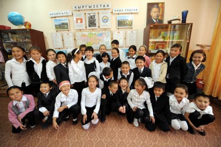 Elnur (5th R, Front) poses for a group photo with his classmates in Bishkek, capital of Kyrgyzstan, on October 26, 2009. 