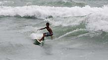 Leonardo Calvo Arrieta goes surfing in Puntarenas, Costa Rica, on November 5, 2009.