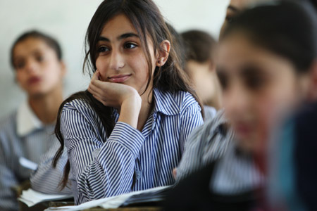 Photo taken on October 22, shows Tala Nasser Ramadan attends class. 