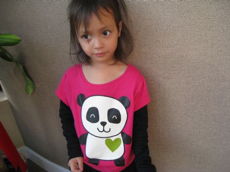 The picture I took on October 24, 2009 shows my four-year-old sister Lucia. She loves panda and she is wearing her favorite shirt. 