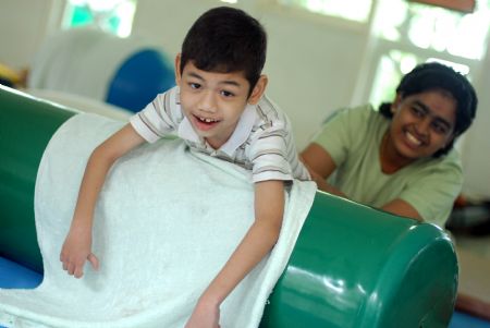 A special child is trained at Tasputra in Kuala Lumpur, Malaysia, on November 20, 2009. 