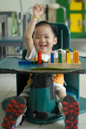 Five-year-old Meng Meng smiles at Tasputra in Kuala Lumpur, Malaysia, on November 20, 2009.