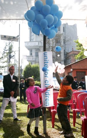 Nepalese children play with balloons during an event to mark the Universal Children's Day in Kathmandu, capital of Nepal, Nov. 20, 2009.(Xinhua/Bimal Gautam)