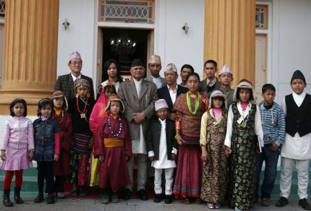 Nepalese President Ram Baran Yadav (C) poses for photo with children during an event to mark the Universal Children's Day at the presidential palace in Kathmandu, capital of Nepal, Nov. 20, 2009. Nepal celebrated the Universal Children's Day with various programs across the country on Friday. (Xinhua/Bimal Gautam)