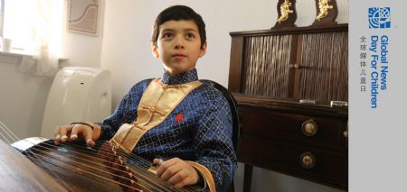 Roderick learns zither in the class of Wang Changyuan in New York, the U.S., Nov. 7, 2009. Roderick Wilson is 10 years old, his father is an American, named Craig Wilson, his mother is an American-Chinese, named Susu Wilson. Roderick began to learn the violin at the age of 4, and began to learn the piano at the age of 5. When he was 7, he is potty about zither after appreciating a concert of Wang Changyuan, a professor in the fields of zither. Because of his passion in learning zither, his parents made a move from Hawaii to New York. Then, Roderick became a student of Wang Changyuan. Roderick is gifted with zither. He has attended many competitions, like the First International Zither Competition held in Hong Kong, China. He won two silver medals in that competition. He has also performed in some famous concert halls. In 2010, he will perform zither with many masters in the National Centre for the Performing Arts in Beijing, China. It is quite difficult for an American boy to learn Chinese traditional instruments. He takes a lot of time in comprehending Chinese implied culture, which makes a great help in achieving his goal. Because of his passion to Zither and unremitting efforts, His success likes successive flowering peony. Besides zither, kungfu is also Roderick 's favorite. (Xinhua/Liu Xin)