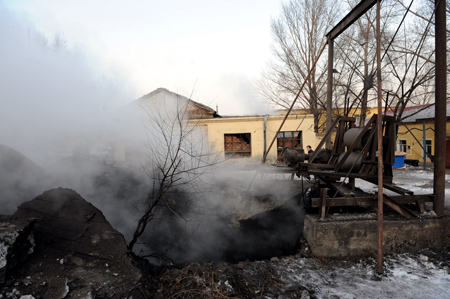 Heavy smoke rises from the entrance to the coal mine in Hegang City, northeast China's Heilongjiang Province, on November 21, 2009. 
