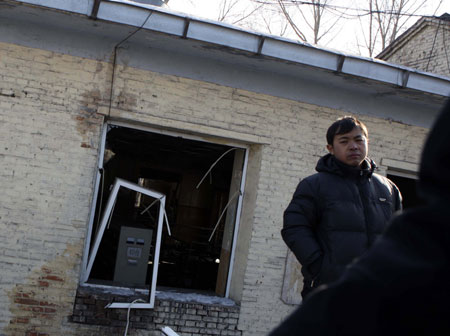 Relatives of coal miners come to the accident site to wait for further information in the Xinxing Coal Mine owned by the Heilongjiang Longmei Mining Holding Group in Hegang City, northeast China's Heilongjiang Province, November 21, 2009. 