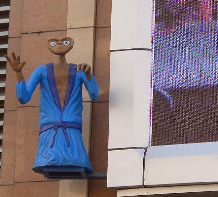 Photo taken on October 28, 2009 by Li Minghao shows a model representing an alien besides an electronic screen in Harbin, northeast China's Heilongjiang Province.