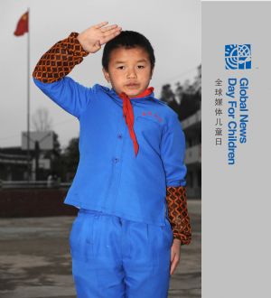 Jia Liuyong salutes at school in Pianpo Village in Guiyang, southwest China's Guizhou Province, on October 28, 2009.