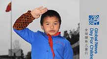 Jia Liuyong salutes at school in Pianpo Village in Guiyang, southwest China's Guizhou Province, on October 28, 2009.