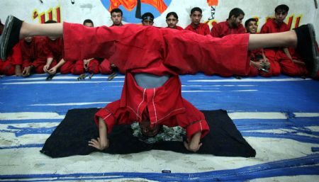 Palestinian children practise Kungfu during martial arts training class at the Red Dragon School in Beit Lahiyathe Town, northern Gaza, Palestine, November 21, 2009.