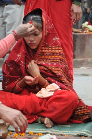 A bride is seen during her wedding ceremony in a temple in Kathmandu, capital of Nepal, on November 21, 2009. 