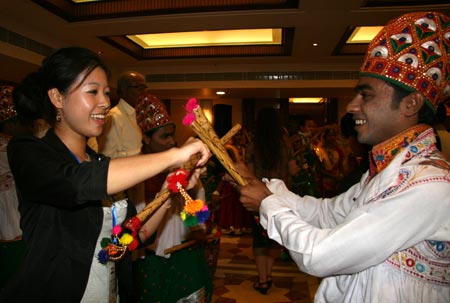 A Chinese youth and an Indian youth exchange gift in Ahmadabad, India, November 24, 2009.