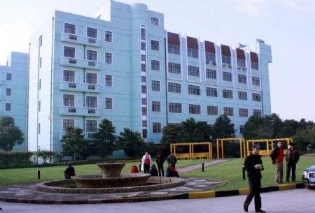 Some people loiter outside the newly-founded Shanghai Anti-Domestic Violence Patronage and Assistance Center, in Shanghai, east China, November 24, 2009.