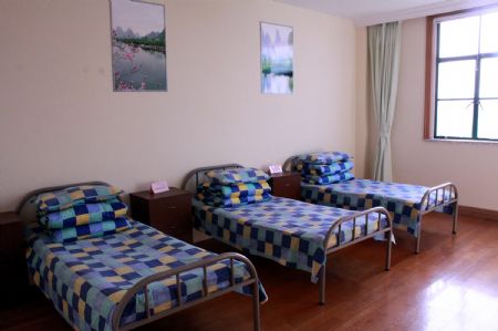 Photo taken on November 24, 2009 shows the beds inside the room of the newly-founded Shanghai Anti-Domestic Violence Patronage and Assistance Center, in Shanghai, east China.