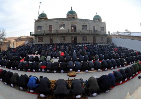Muslims pray at a mosque to celebrate the Corban Festival, or Eid Al-adha in Tongxin County, northwest China's Ningxia Hui Autonomous Region, November 27, 2009.