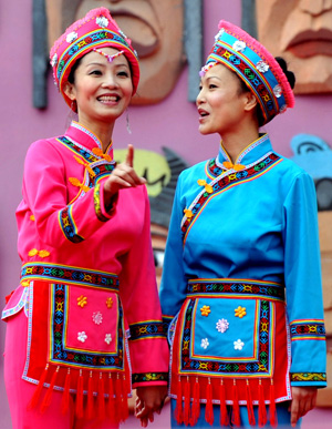 Local ethnic Mulam people dressed with their traditional costumes perform during a celebration in Luocheng Mulam Autonomous County of southwest China's Guangxi Zhuang Autonomous Region, November 28, 2009. Ethnic Mulam people celebrated the traditional festival of harvest and wishes on Saturday.