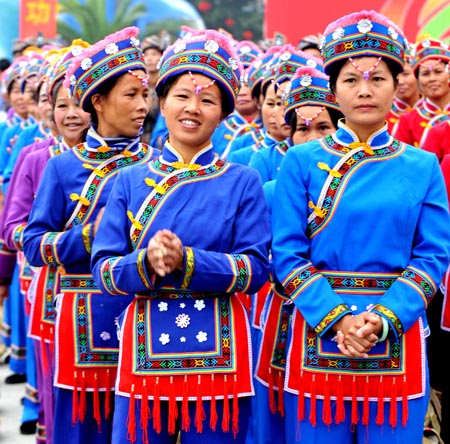 Local ethnic Mulam people dressed with their traditional costumes perform during a celebration in Luocheng Mulam Autonomous County of southwest China's Guangxi Zhuang Autonomous Region, November 28, 2009. Ethnic Mulam people celebrated the traditional festival of harvest and wishes on Saturday.