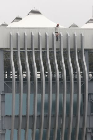 Workers proceed on the building site of China Ship Corporate Pavilion of the 2010 Shanghai World Expo in Shanghai, east China, November 29, 2009. Most of the pavilions are taking on a dashing look with the coming of the 2010 Shanghai World Expo, which will fall in May of next year.