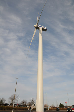 A wind turbine is seen in front of the Bella Center, where the UN Climate Change Conference will be held, in Copenhagen, capital of Denmark, November 21, 2009.