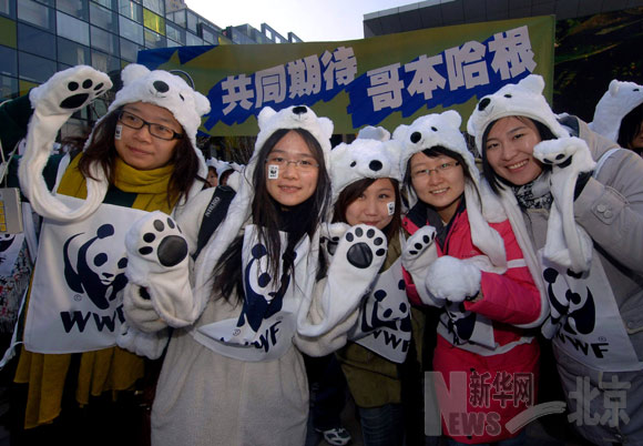 Volunteers dress in the polar bear costumes participate in an activity held by the World Wide Fund for Nature (WWF) to welcome the UN climate change conference in Copenhagen, in Beijing, capital of China, December 2, 2009. 