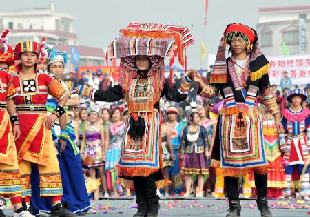 People of Yao ethnic group present traditional costumes during the opening ceremony of the 2009 China (Hezhou) Panwang Festival in Hezhou, southwest China's Guangxi Zhuang Autonomous Region, on December 2, 2009. The Panwang Festival is a festival celebrated by people of Yao ethnic group on October 16th on the Chinese lunar calendar to worship their ancestor.