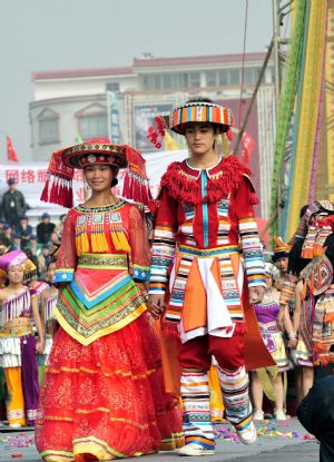 People of Yao ethnic group present traditional costumes during the opening ceremony of the 2009 China (Hezhou) Panwang Festival in Hezhou, southwest China's Guangxi Zhuang Autonomous Region, on December 2, 2009.