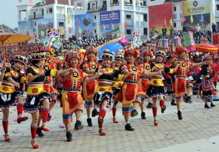People of Yao ethnic group dance during the opening ceremony of the 2009 China (Hezhou) Panwang Festival in Hezhou, southwest China's Guangxi Zhuang Autonomous Region, on December 2, 2009.