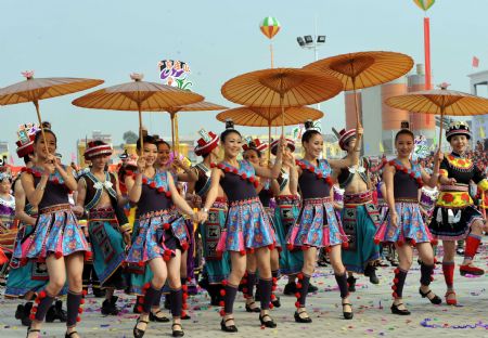 People of Yao ethnic group dance during the opening ceremony of the 2009 China (Hezhou) Panwang Festival in Hezhou, southwest China's Guangxi Zhuang Autonomous Region, on December 2, 2009. 