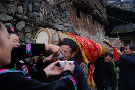 People of Miao ethnic group celebrate Guzang Festival in Wuliu Village of Leishan County, southwest China's Guizhou Province, December 1, 2009.