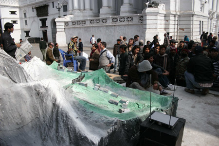 NNepalese people view the replica of the Himalayan region during an exhibition at Basantapur Durbar Square in Kathmandu, capital of Nepal, December 6, 2009. 