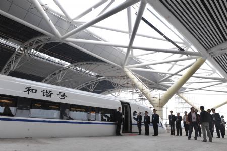 The test-running train prepares for its first journey at the station in Guangzhou, capital of south China's Guangdong Province, December 9, 2009. 