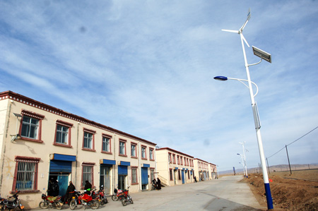 Photo taken on December 1, 2009 shows the lamp that uses both solar and wind energy in a village in Tibetan Autonomous Prefecture of Huangnan in northwest China&apos;s Qinghai Province.