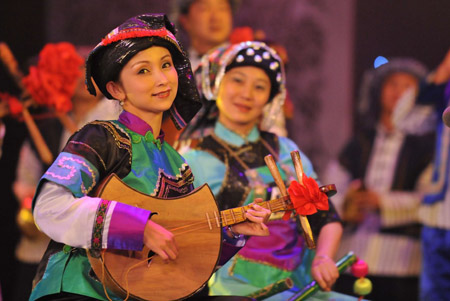 Actresses present a performance of Buyei ethnic group during the closing ceremony of Guizhou Minority Culture and Art Show in Kaili, southwest China's Guizhou Province, December 10, 2009. The ten-day performance lowered the curtain here on Thursday. 