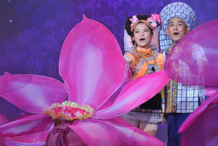 Actors present a performance of Buyei ethnic group during the closing ceremony of Guizhou Minority Culture and Art Show in Kaili, southwest China's Guizhou Province, December 10, 2009.