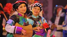 Actresses present a performance of Buyei ethnic group during the closing ceremony of Guizhou Minority Culture and Art Show in Kaili, southwest China's Guizhou Province, December 10, 2009. The ten-day performance lowered the curtain here on Thursday.