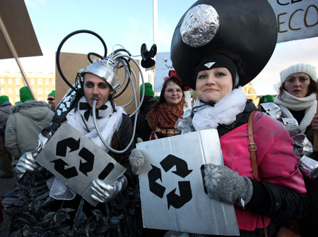 Environmentalists who advocate waste recycle attend the Global Day of Action at parliament square in Copenhagen, capital of Denmark, on December 12, 2009.