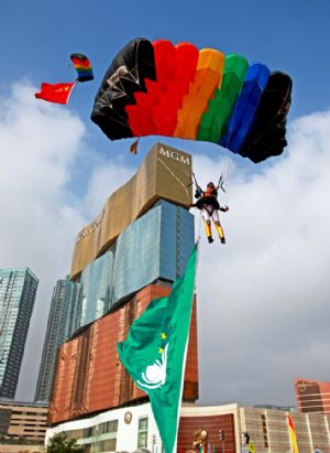 Members of the Bayi (Aug. 1) Parachute Jumping Team of the Air Force of the Chinese People's Liberation Army (PLA) perform to celebrate the 10th anniversary of Macao's return to China, in Macao, south China, Dec. 13, 2009