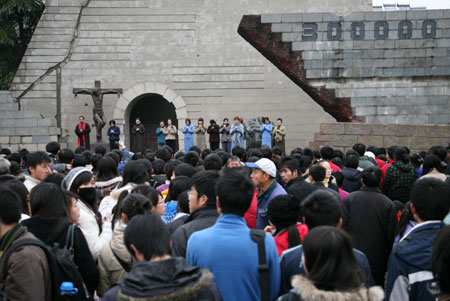Performers present drama &apos;Occupation&apos; on the square in front of the Memorial Hall of the Victims in the Nanjing Massacre, marking the 72nd anniversary of the tragedy, in Nanjing, capital of east China&apos;s Jiangsu Province, Decemebr 13, 2009.
