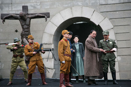 Performers present drama &apos;Occupation&apos; on the square in front of the Memorial Hall of the Victims in the Nanjing Massacre, marking the 72nd anniversary of the tragedy, in Nanjing, capital of east China&apos;s Jiangsu Province, Decemebr 13, 2009.