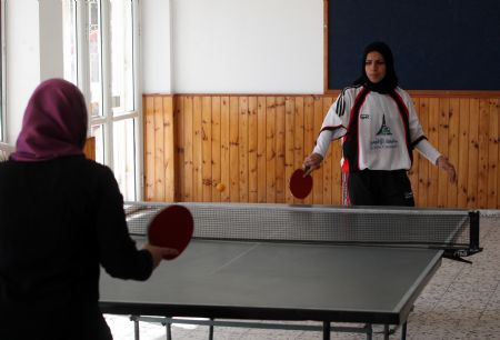 Palestinian women play table tennis in a competition among women in the Hamas-run Gaza Strip on December 13, 2009. 