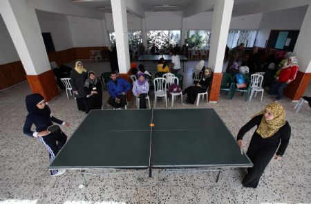 Palestinian women play table tennis in a competition among women in the Hamas-run Gaza Strip on December 13, 2009. 