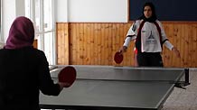 Palestinian women play table tennis in a competition among women in the Hamas-run Gaza Strip on December 13, 2009.