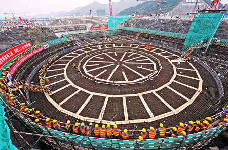 The photo taken on December 14, 2009 shows workers prepare at the construction site of the second of the two generating units of the Sanmen nuclear power plant in east China's Zhejiang Province. 