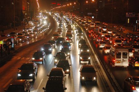 The photo taken on Decemeber 15, 2009 shows the vehicle flow on the West Second Loop Road in Beijing. 