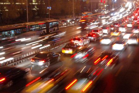 The photo taken on December 15, 2009 shows the vehicle flow on the West Second Loop Road in Beijing. 