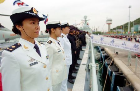 Chinese naval women soldiers line up on 'Zhoushan' missile frigate during a seeing-off ceremony in Hong Kong, south China, on December 17, 2009.