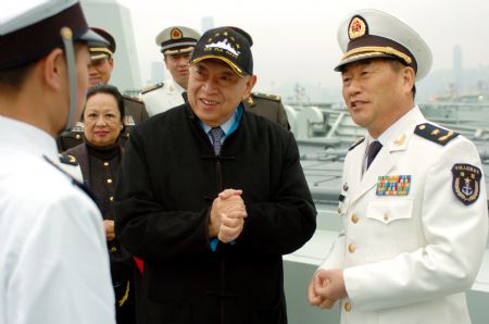 Tung Chee-hwa (2nd R), vice chairman of the National Committee of the Chinese People's Political Consultative Conference, who was the first chief executive of the Hong Kong Special Administrative Region (SAR), visits Chinese naval soldiers accompanied by Wang Zhiguo, commander of the Chinese naval 3rd escort fleet, during a seeing-off ceremony in Hong Kong, south China, on December 17, 2009.